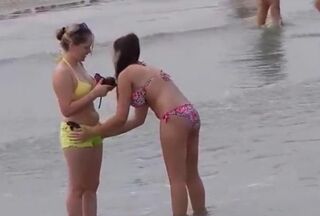 Woman masterbating at beach